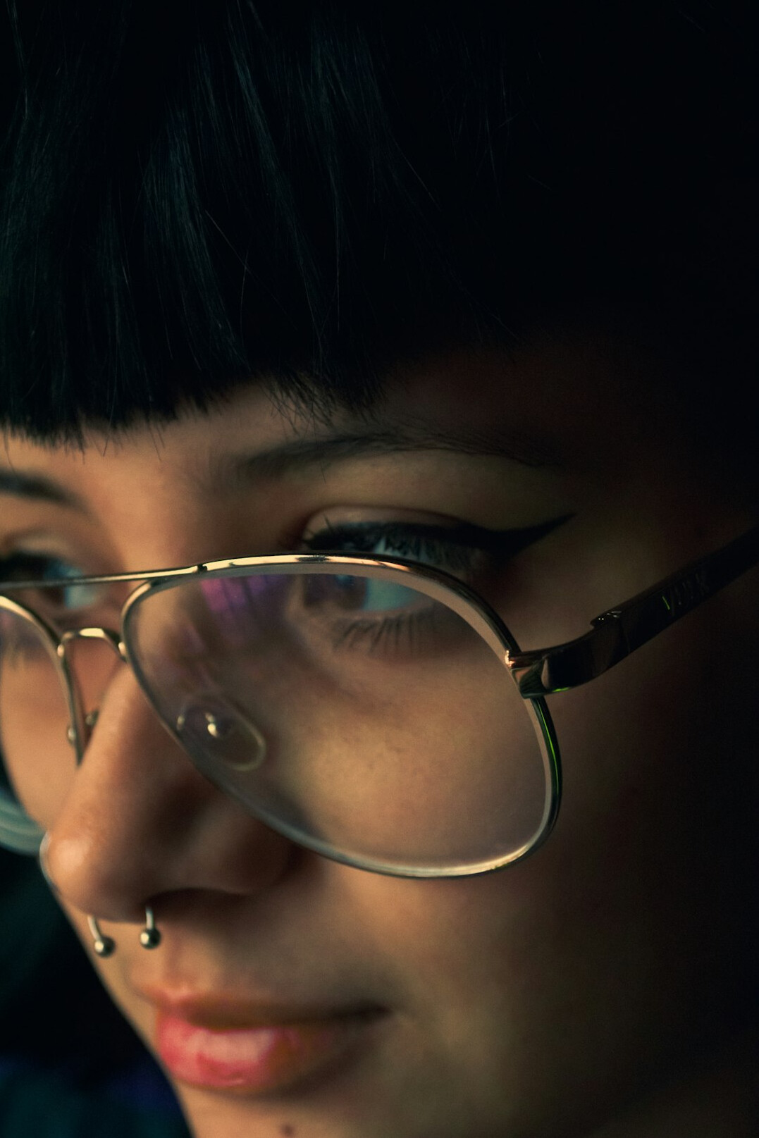Studio portrait of a woman with glasses