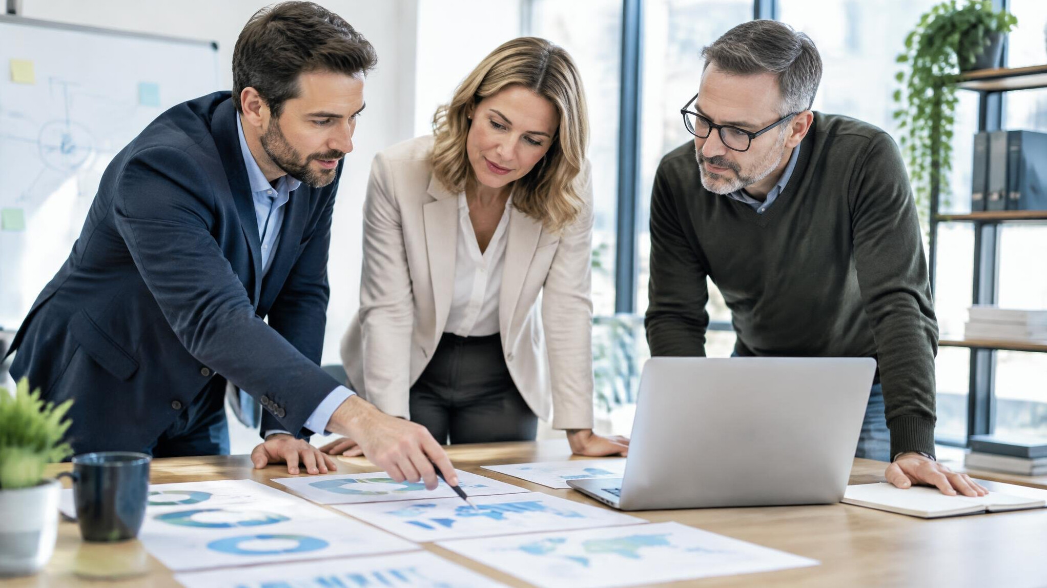 Team reviewing a strategic plan on a table