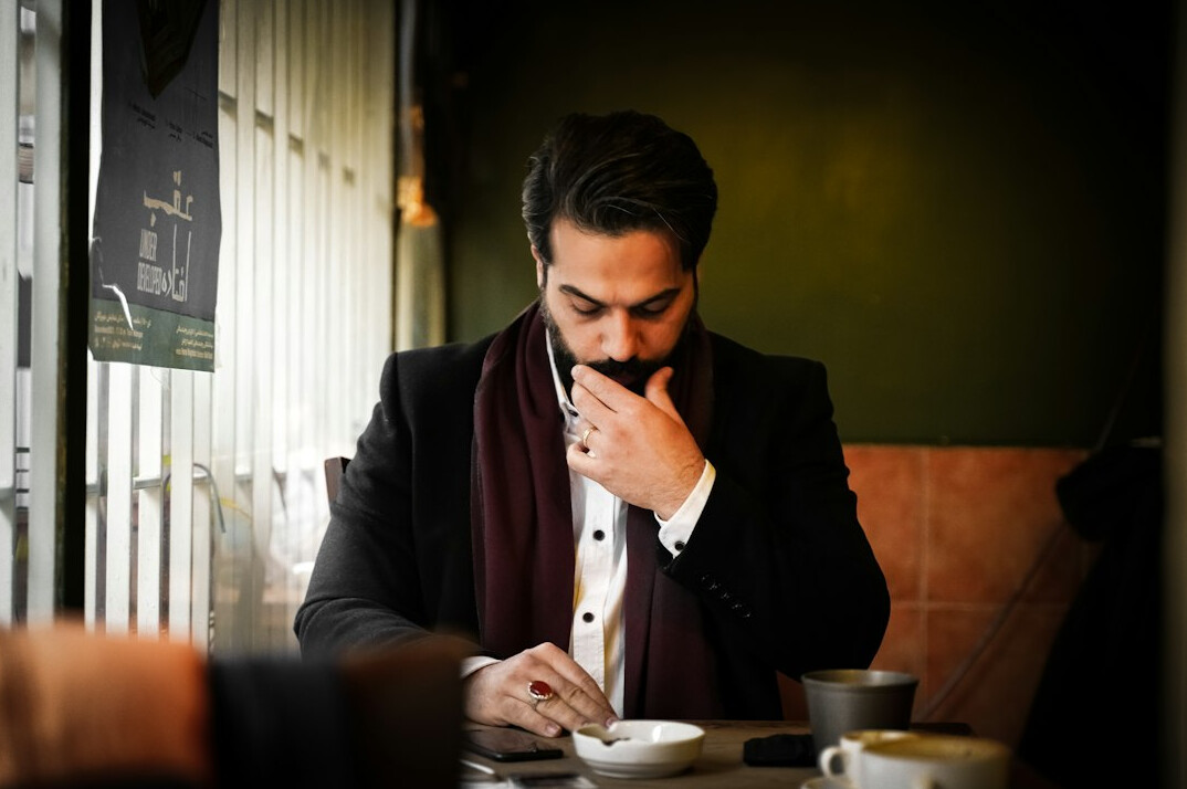 Business professional writing notes during a strategy session